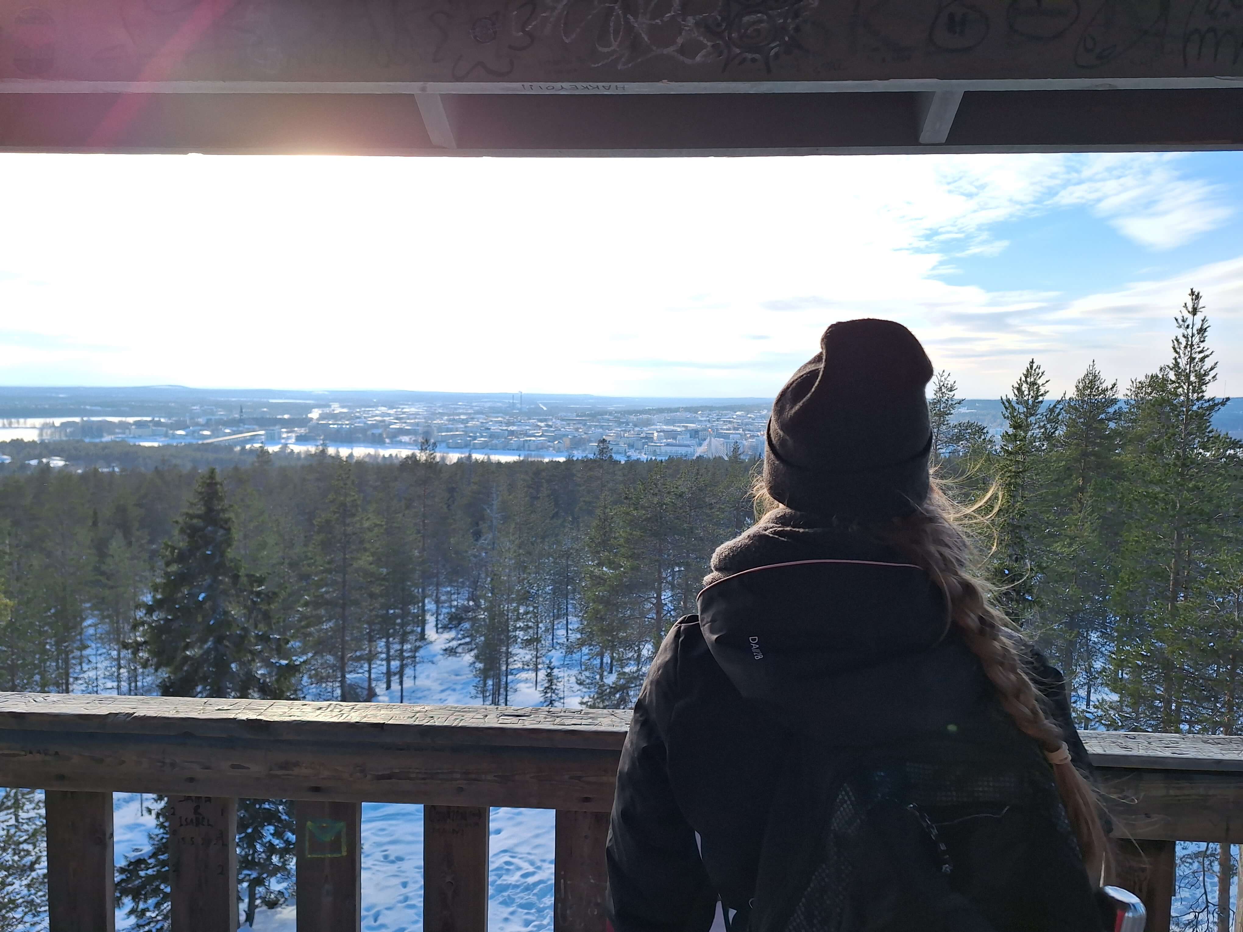 Admiring the view on Rovaniemi from a viewpoint.