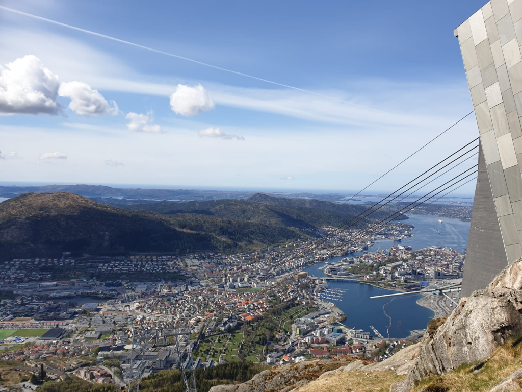 Cable car ascending Mount Ulriken in Bergen, offering panoramic views of the city, mountains, and fjords.